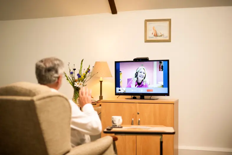 Homesight Connected Care senior monitoring system displayed on TV for families in Boise, Meridian, and Treasure Valley Idaho